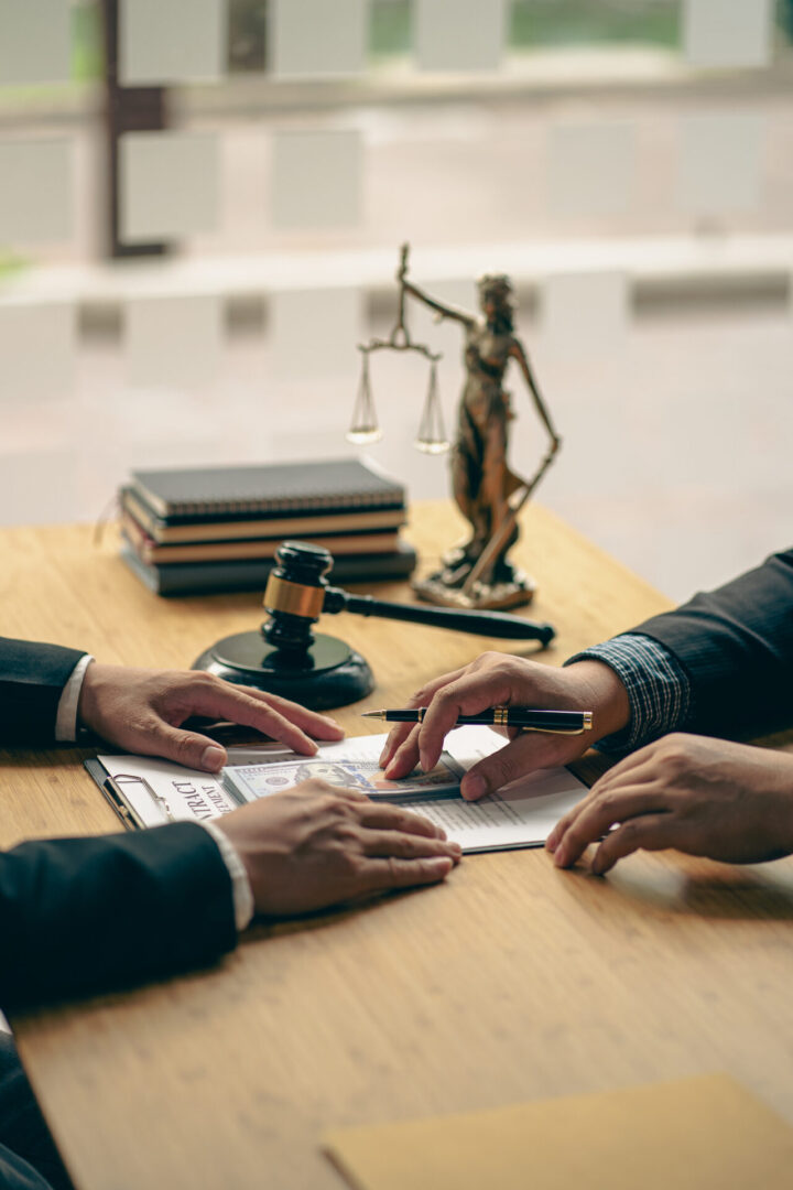 Lawyer and client reviewing legal documents